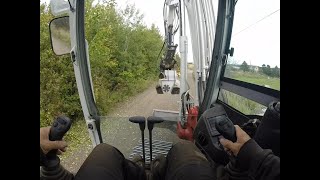 Excavator mulching roadside vegetation [upl. by Orrocos]