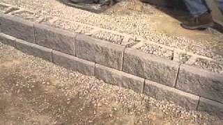 DIY Superstore  Installing a Retaining Wall [upl. by Wernher56]