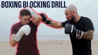 How To Block A Punch  Defensive Blocking Drill [upl. by Jaimie]